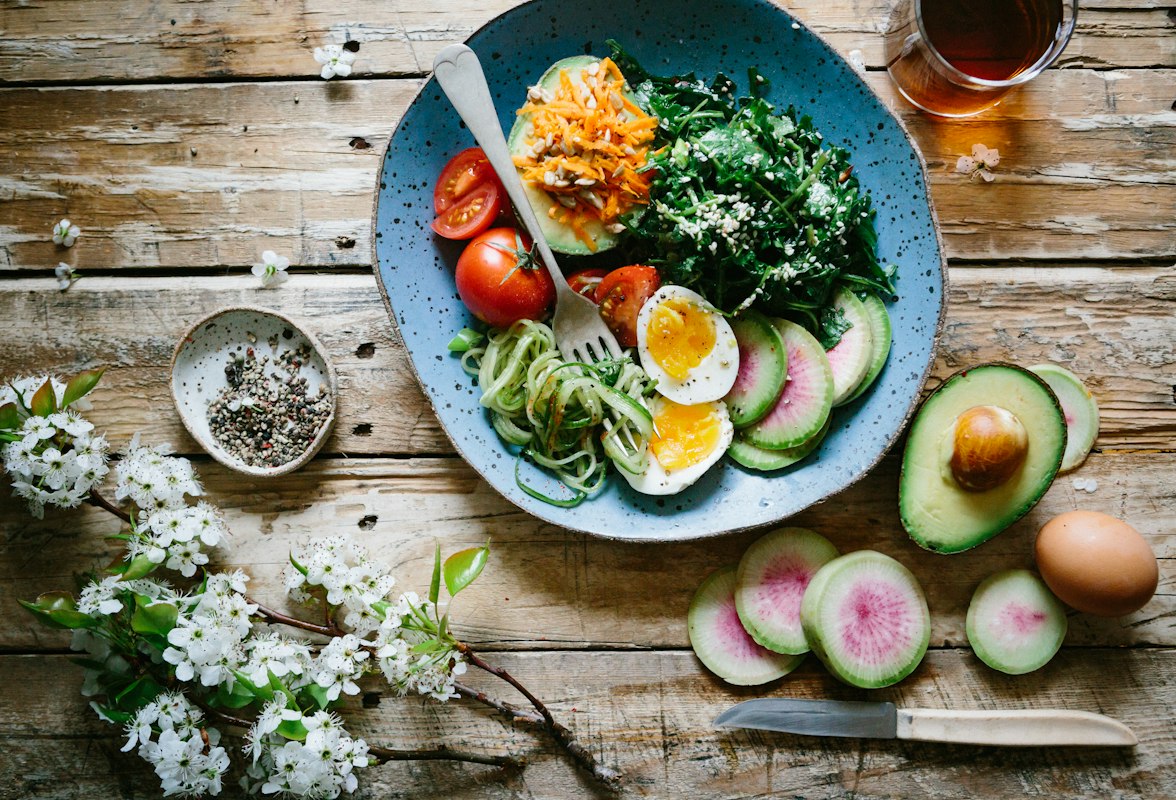 Fresh colorful salad bowl with vegetables and greens